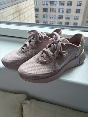 Nike reposto Women's Blush Pink Mesh Training Sneakers.